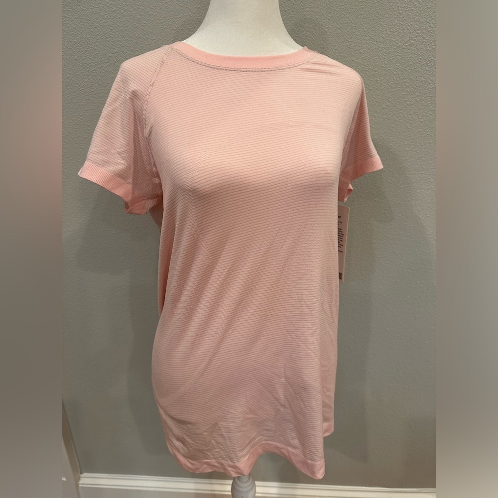 Pink Lulu lemon tech shirt. Short sleeve. New with tags
